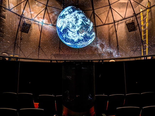 A Lambda installation with work lights on showing dome.